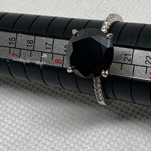 Moissanite 2CT. T.W. Enhanced Black and
Solitaire Ring size 9